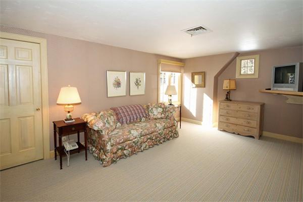 47 Walnut Road Weston, MA 02493 - Photo 21 of 25 a living room with furniture and a lamp