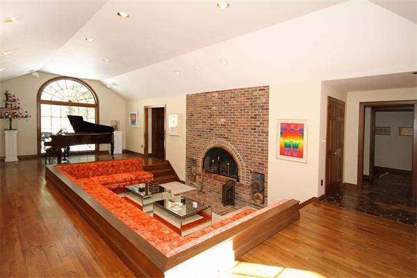 47 Walnut Road Weston, MA 02493 - Photo 3 of 25 a living room with furniture a fireplace and a table with wooden floor