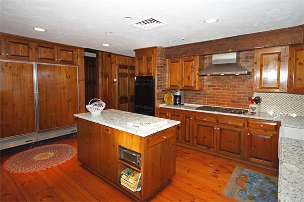 47 Walnut Road Weston, MA 02493 - Photo 8 of 25 a kitchen with stainless steel appliances granite countertop a sink stove and refrigerator