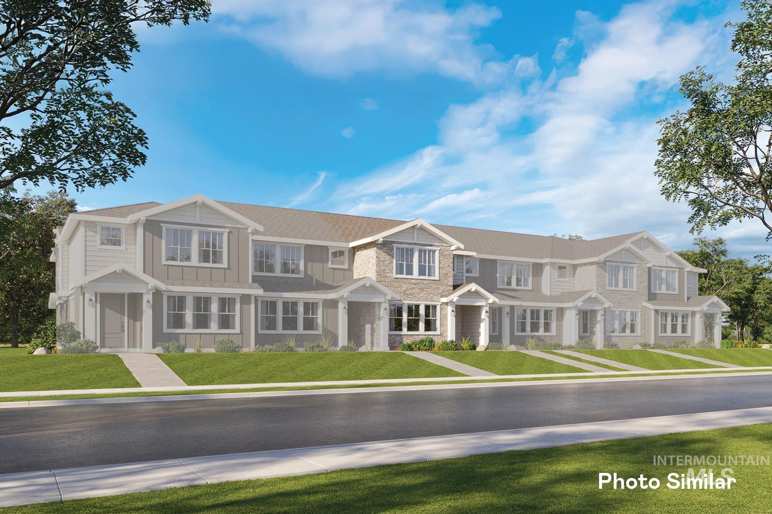 4218 West Perspective Street Eagle, ID 83616 - Photo 1 of 1 View of front of property with an attached garage, a front yard, and stone siding
