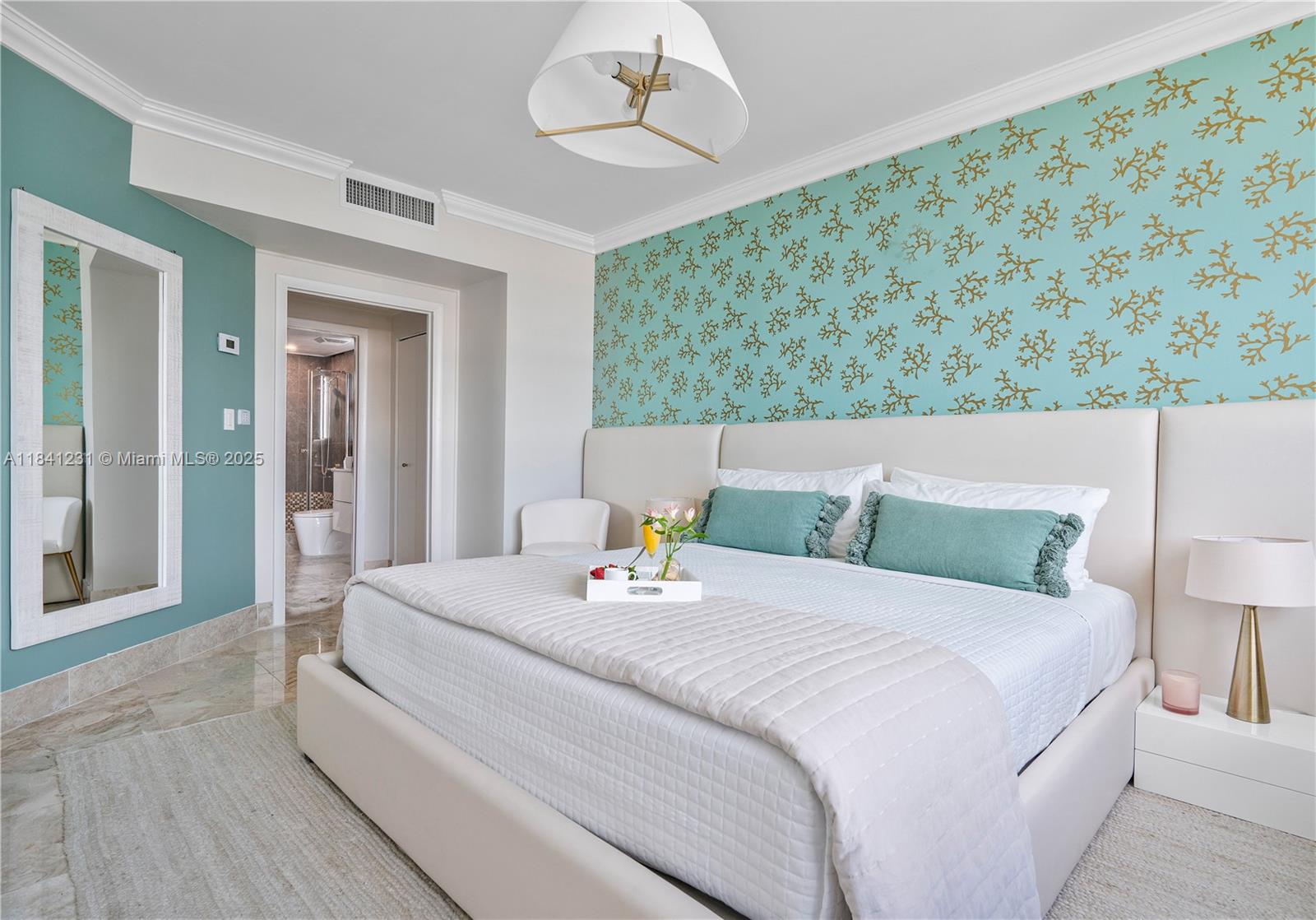 2889 McFarlane Road, Unit 1801 Miami, FL 33133 - Photo 30 of 38 a bedroom with a bed and a chandelier