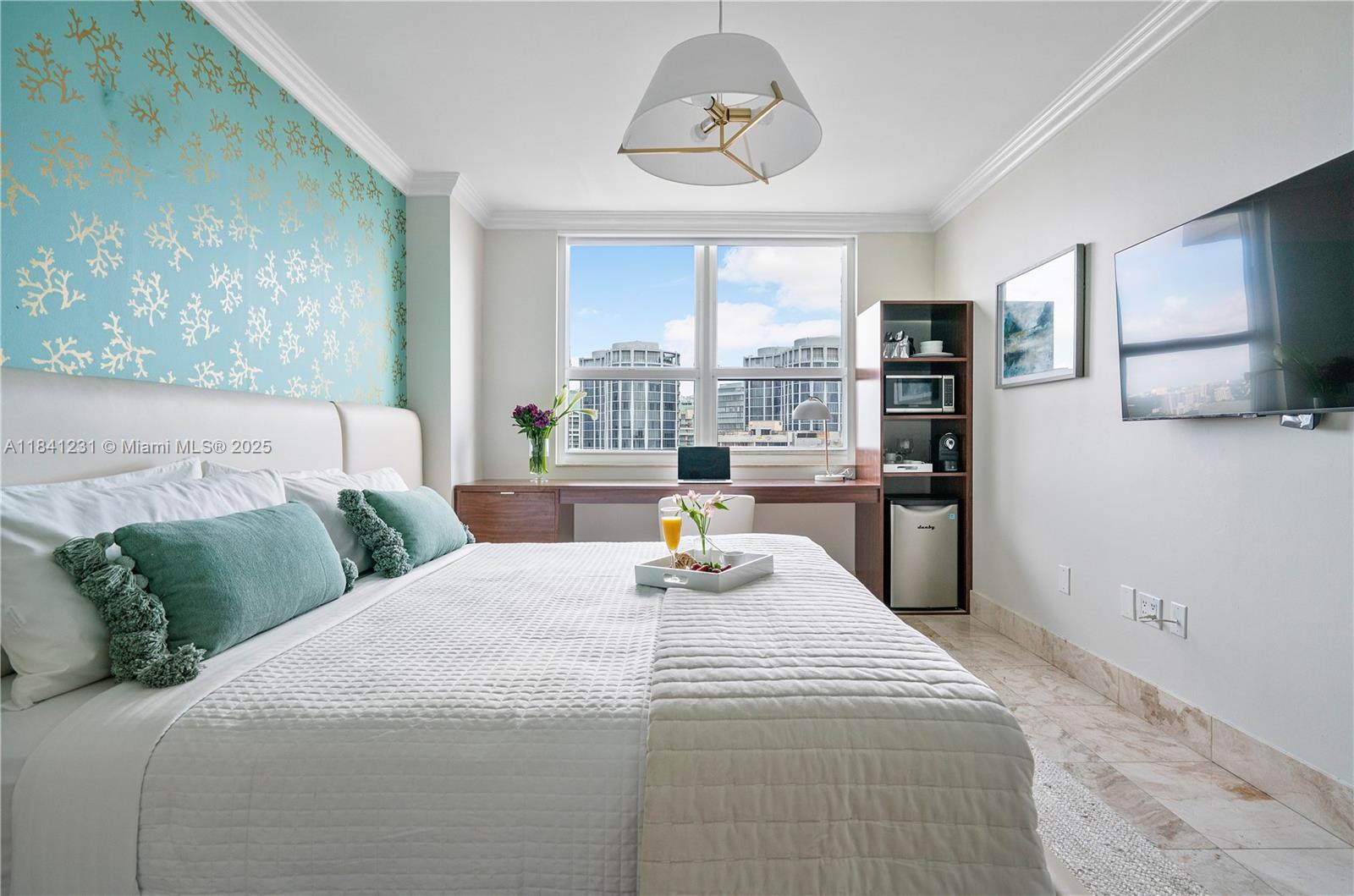 2889 McFarlane Road, Unit 1801 Miami, FL 33133 - Photo 33 of 38 a bedroom with a bed a couch and large window