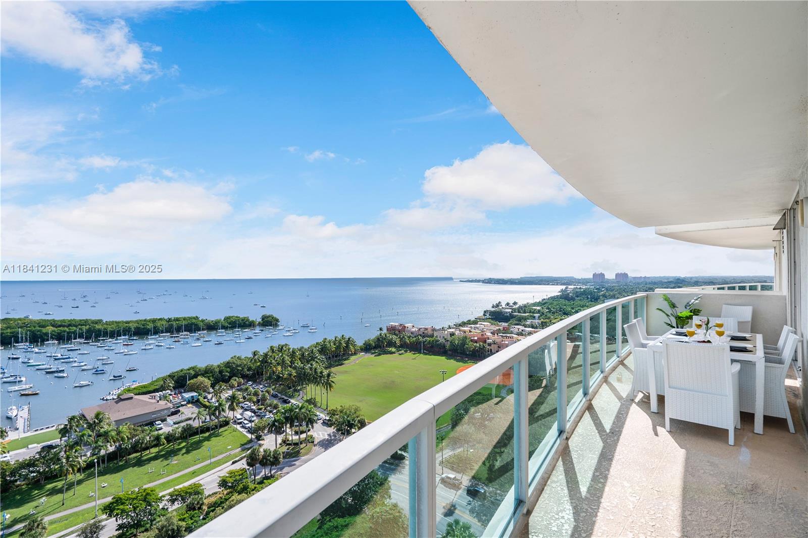 2889 McFarlane Road, Unit 1801 Miami, FL 33133 - Photo 4 of 38 a view of a balcony with an ocean view