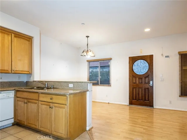 a kitchen with stainless steel appliances granite countertop a stove and a sink