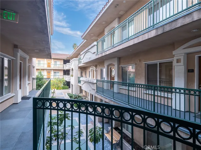 a view of a balcony with furniture