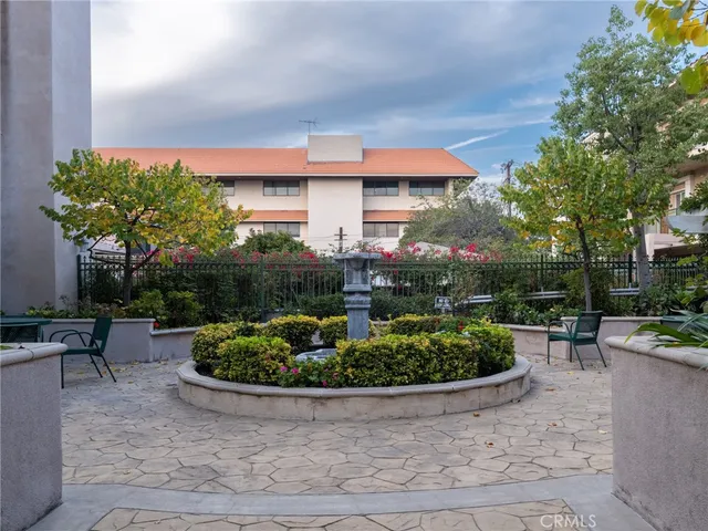 a view of a backyard with sitting area