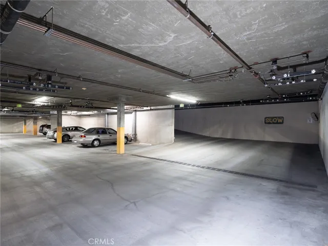 a view of parking space with parked car