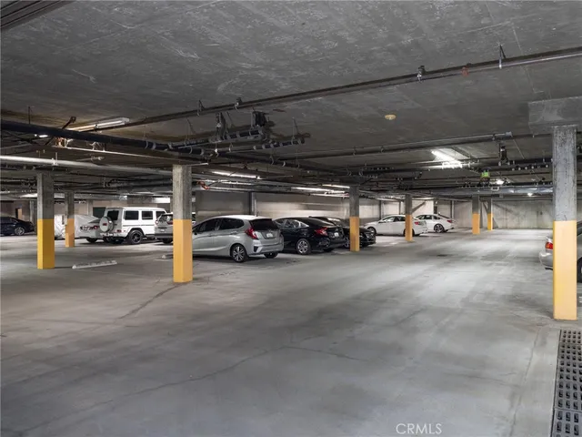 a view of parking space with parked cars