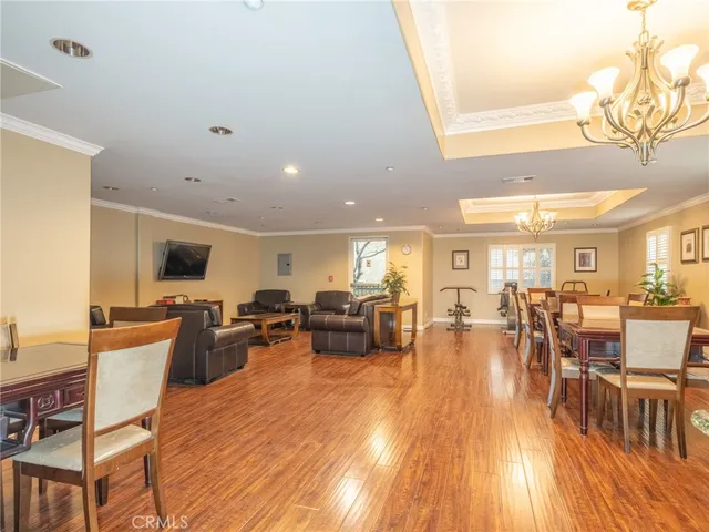 a living room with fireplace furniture and a flat screen tv