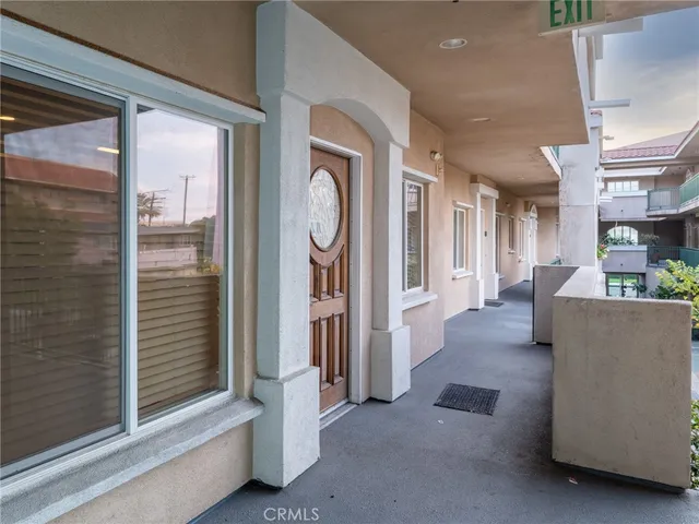 a view of a living room with furniture and a window