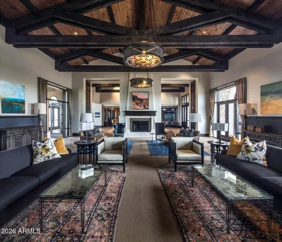 a living room with furniture or chandelier and a fireplace