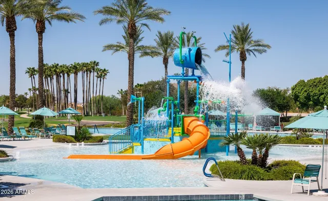 a swimming pool with outdoor seating and yard