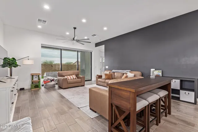 a living room with furniture and a large window