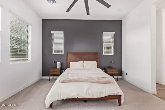 a bedroom with a bed and window