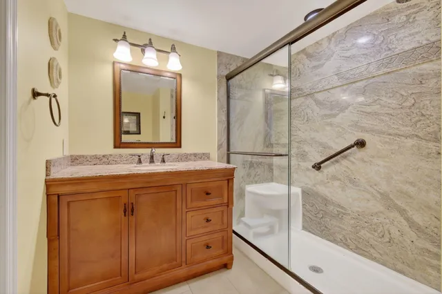 a living room with furniture and a book shelf