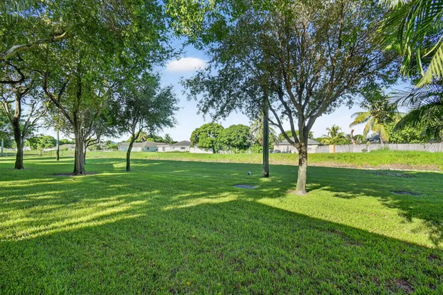 a view of swimming pool in a backyard