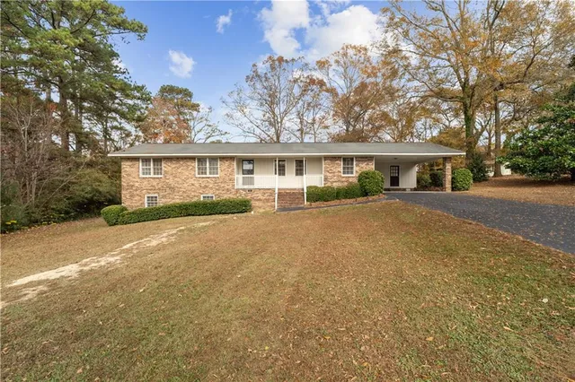 front view of a house next to a yard
