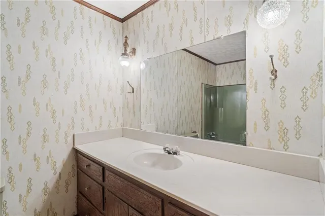 a bathroom with a sink and a mirror