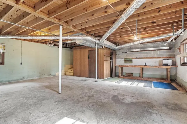 a view of empty room with wooden ceiling