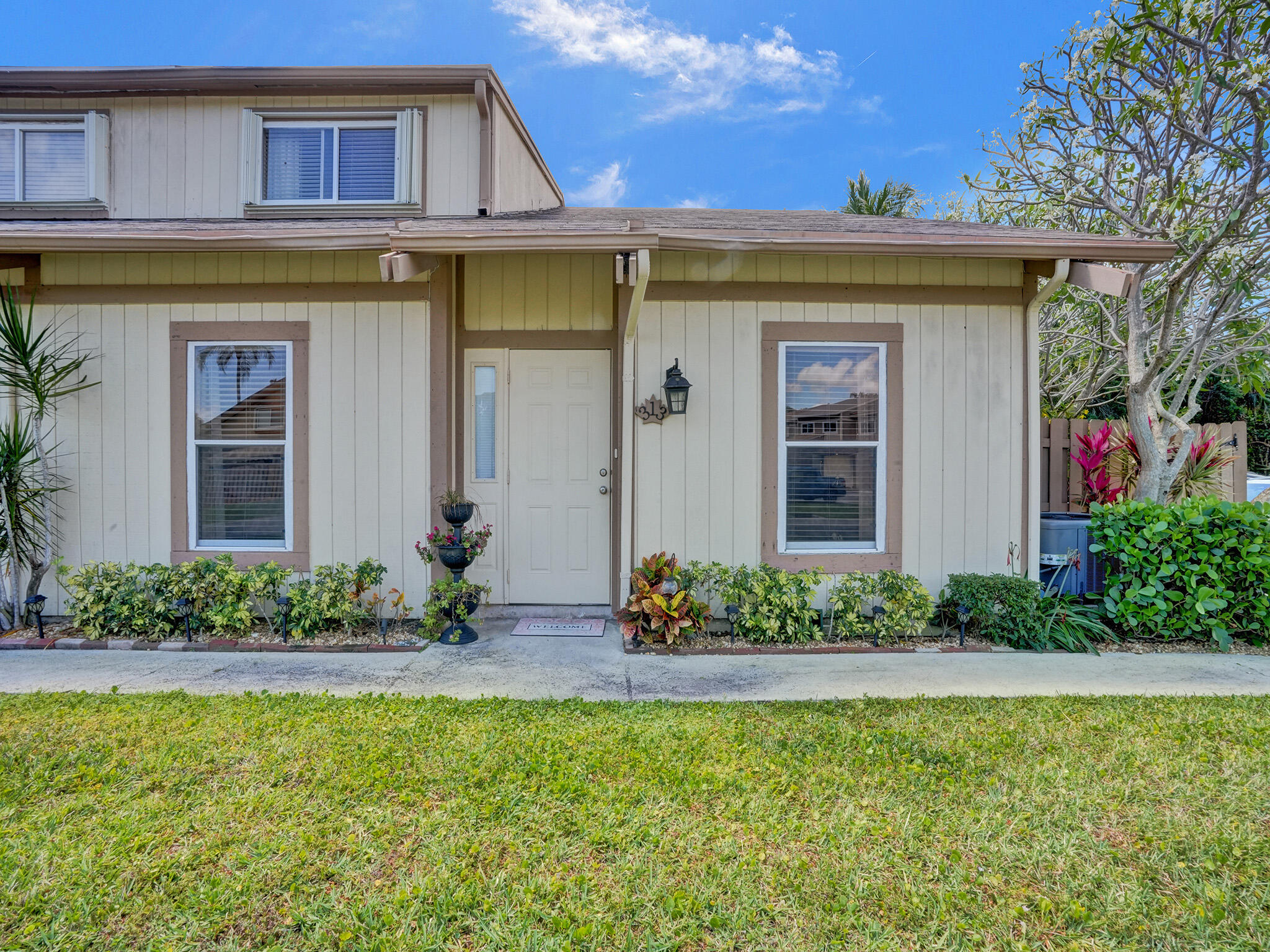 313 Maplecrest Circle Jupiter, FL 33458 - Photo 2 of 30 Townhouse Front