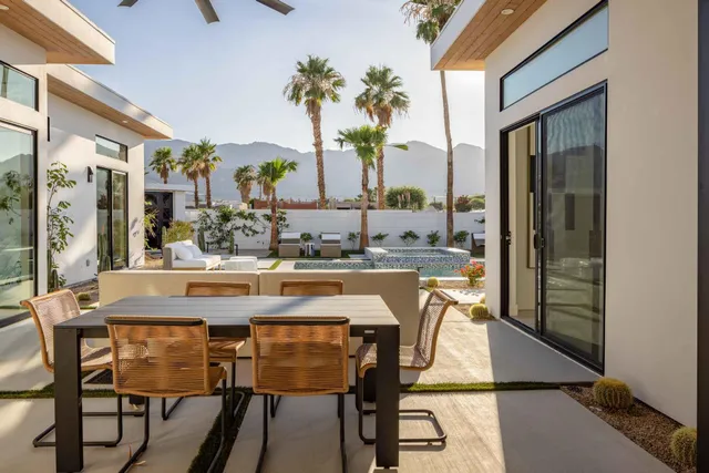 a view of a dining room with furniture window and outside view
