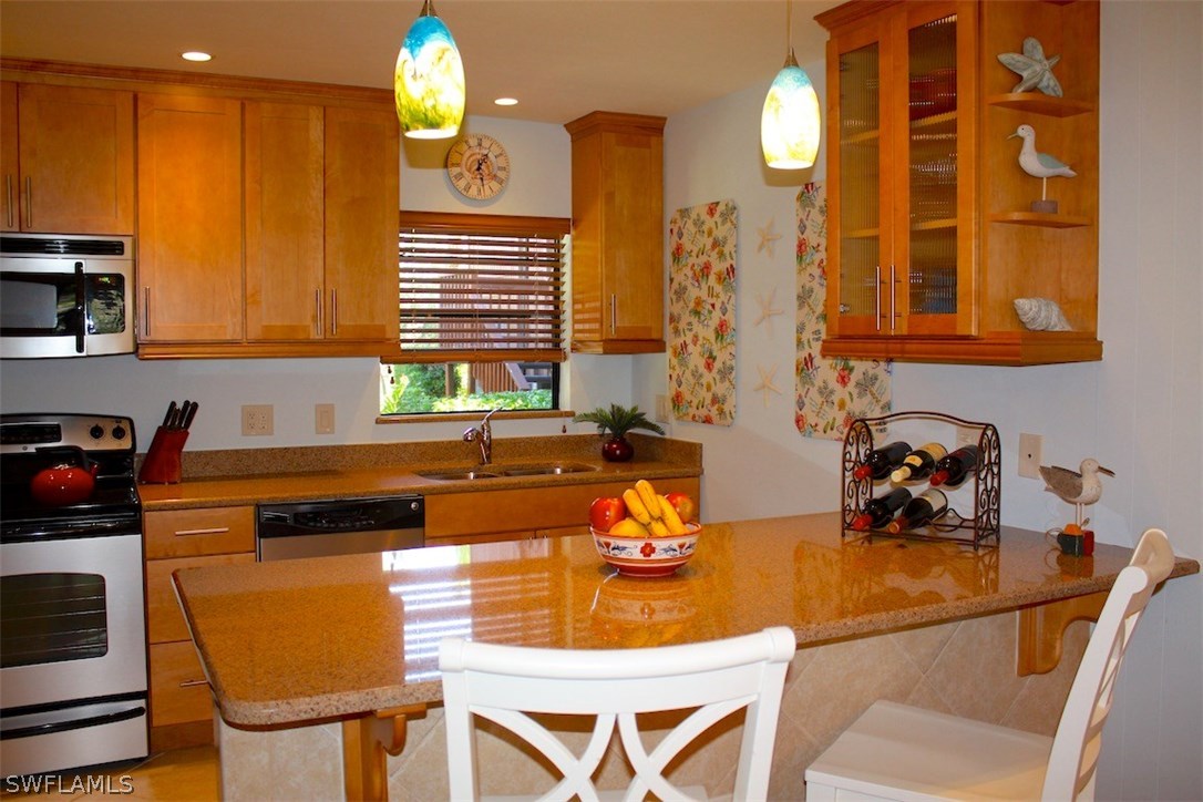 5117 Sea Bell Road, Unit F108 Sanibel, FL 33957 - Photo 4 of 17 a kitchen with a sink and cabinets