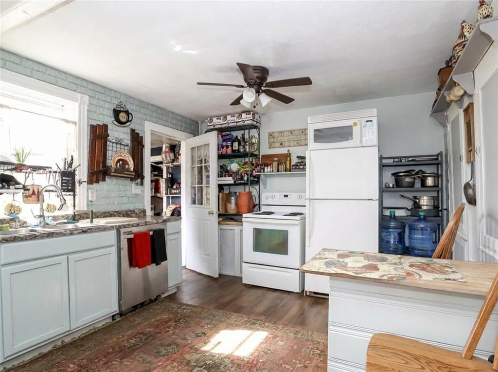 636 Holmdel Road Hazlet, NJ 07730 - Photo 14 of 47 a kitchen with refrigerator and cabinets