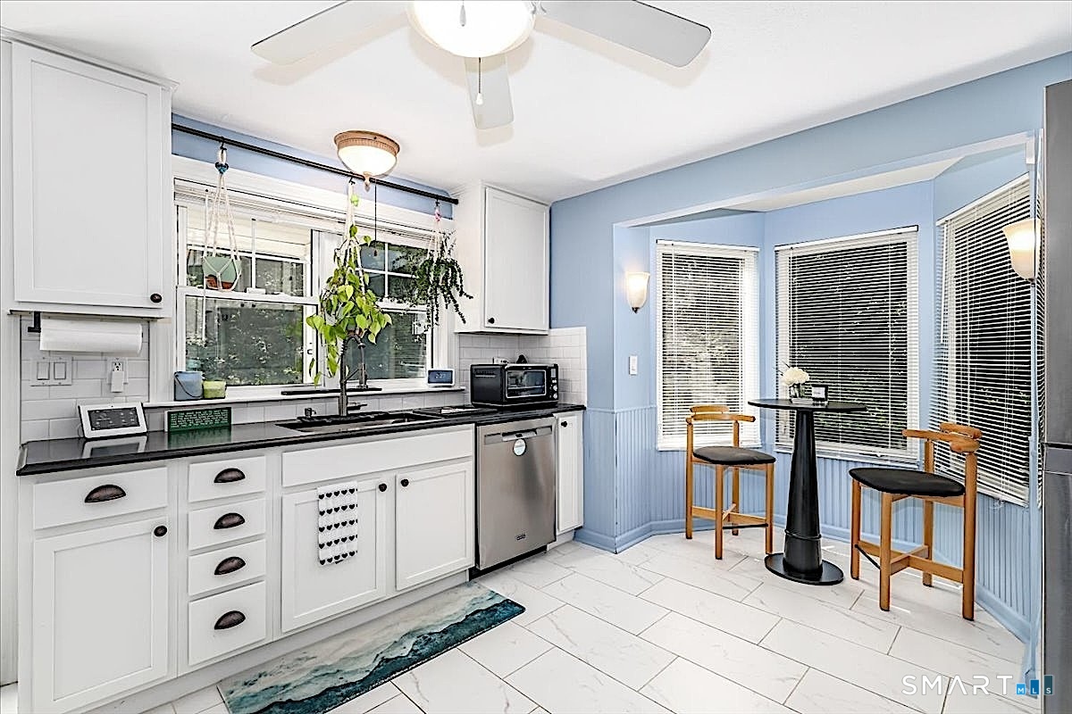 313 Torrington Road Litchfield, CT 06759 - Photo 6 of 26 Charming Sunlit Breakfast Nook Surrounded by Windows