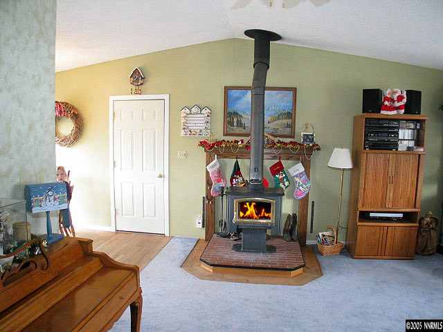 3860 Fulmar Court Reno, NV 89508 - Photo 4 of 9 a living room with furniture and a flat screen tv