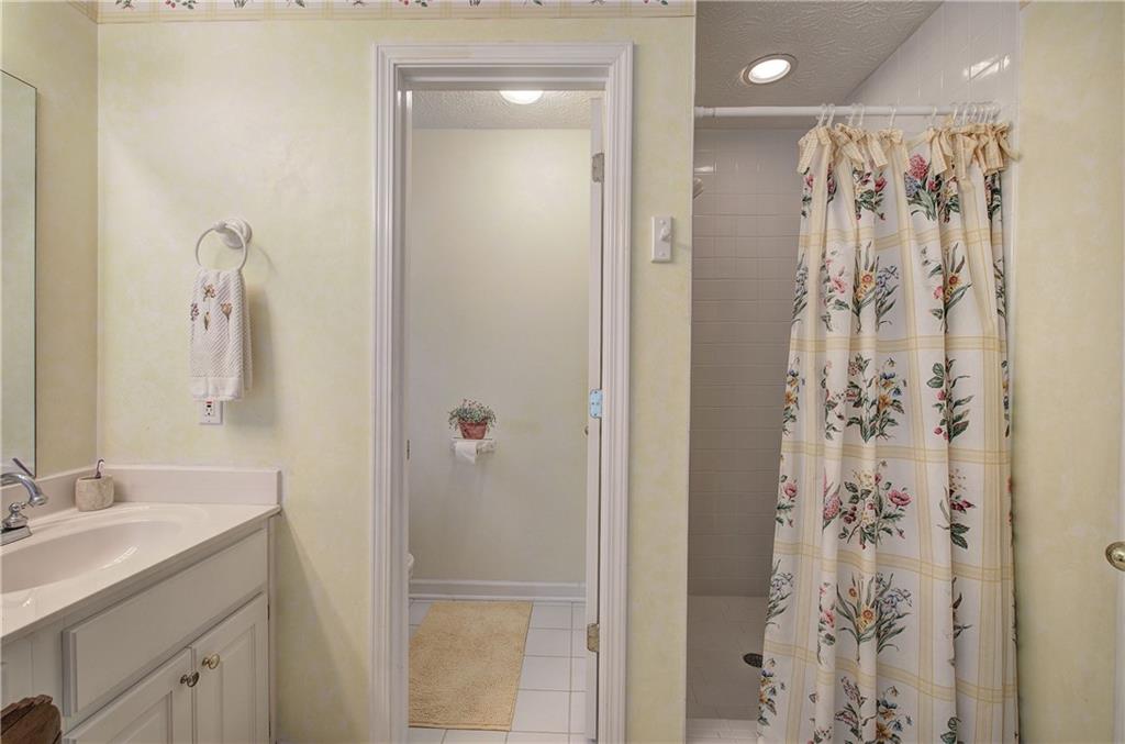 1379 Little Hendricks Mountain Road Jasper, GA 30143 - Photo 26 of 56 a bathroom with a shower and a sink