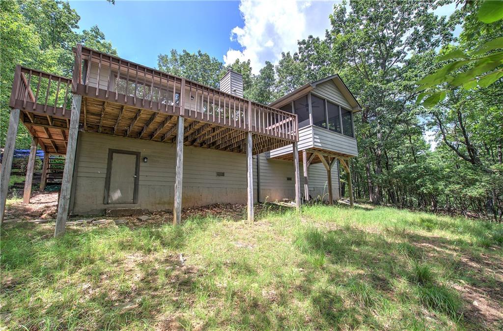 1379 Little Hendricks Mountain Road Jasper, GA 30143 - Photo 32 of 56 a view of a house with a yard