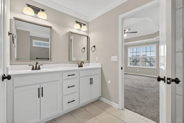 a bathroom with a glass shower door