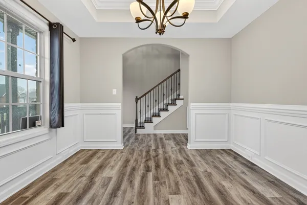 a view of entryway with wooden floor