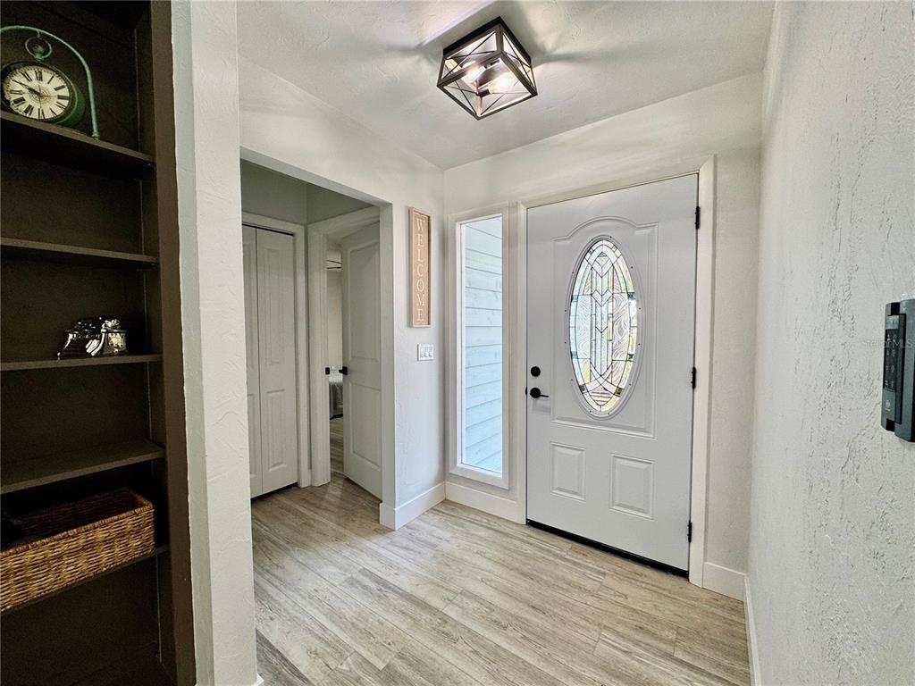 5407 Southwest 82 Terrace Gainesville, FL 32608 - Photo 5 of 31 a view of a hallway with wooden floor