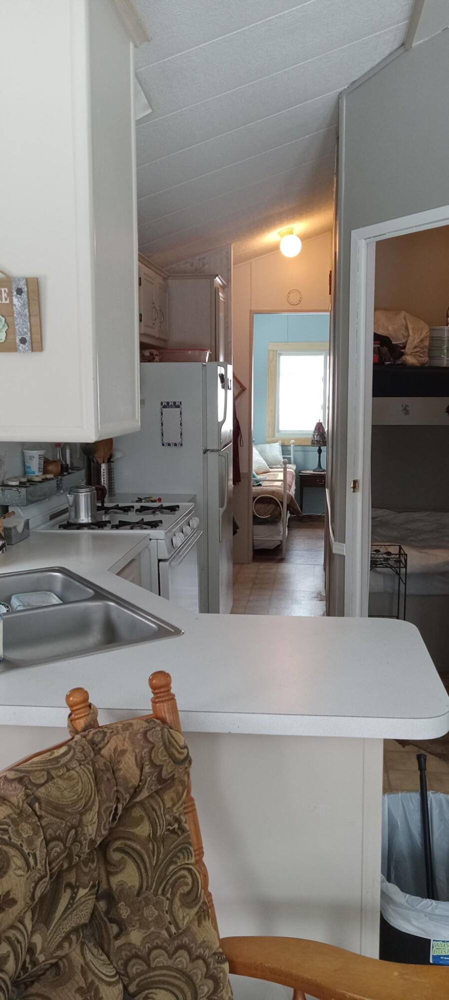 108 Green Road Fairfield, ME 04937 - Photo 8 of 17 0424 kitchen stove ,refrig, hall to bedr