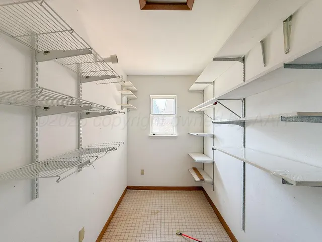 a view of a room with racks on the wall