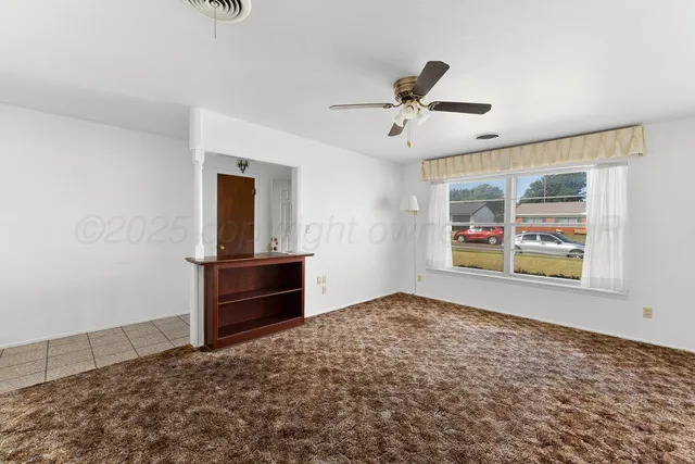 a view of an empty room and window