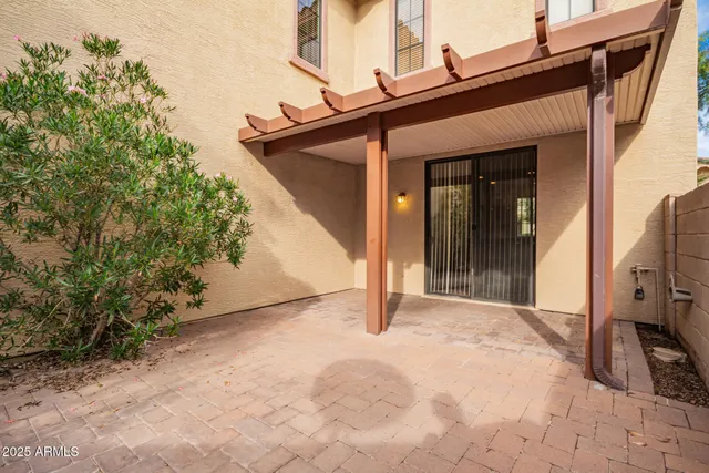 a view of a house with a yard patio and sitting area
