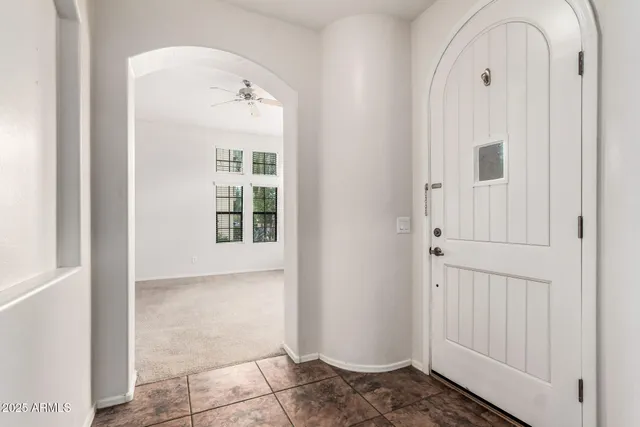 a view of a hallway with windows