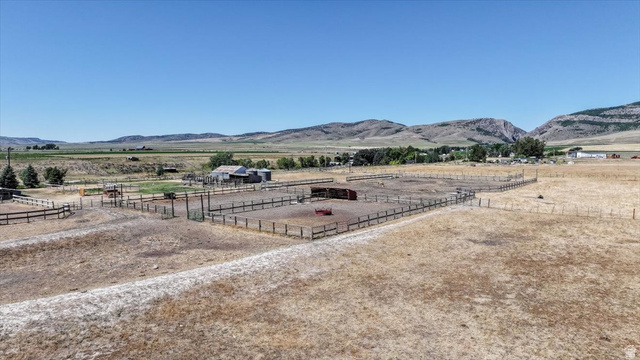 1634 West Arimo Road Arimo, ID 83214 - Photo 77 of 89 Expansive outdoor property with multiple fenced enclosures and a distant agricultural building