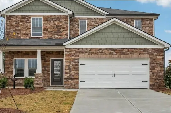 front view of a house with a yard