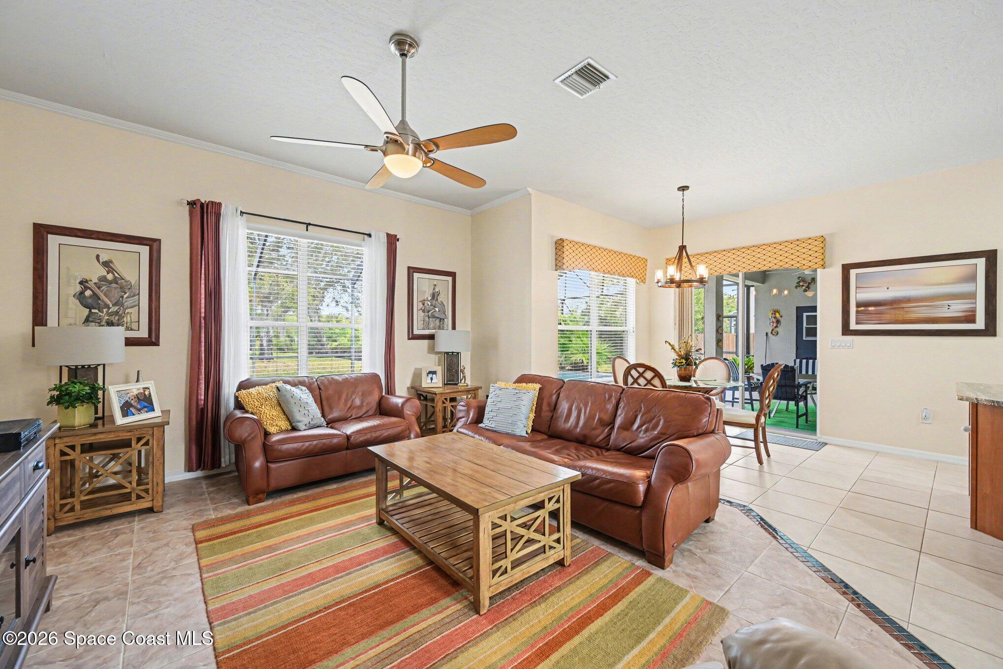 3760 Fringetree Lane Melbourne, FL 32940 - Photo 20 of 36 a living room with furniture and a large window