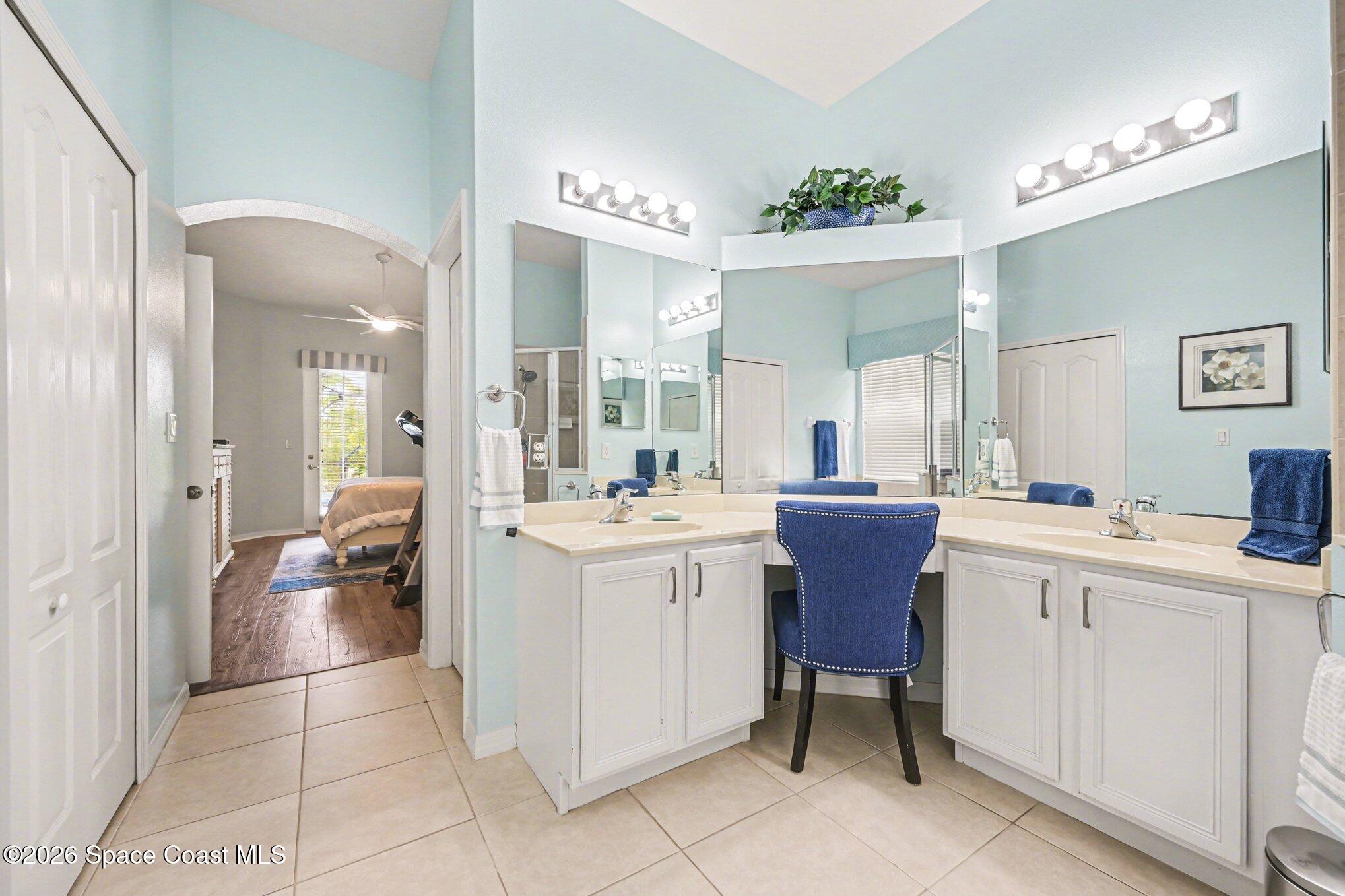 3760 Fringetree Lane Melbourne, FL 32940 - Photo 25 of 36 a bathroom with a sink vanity and a mirror