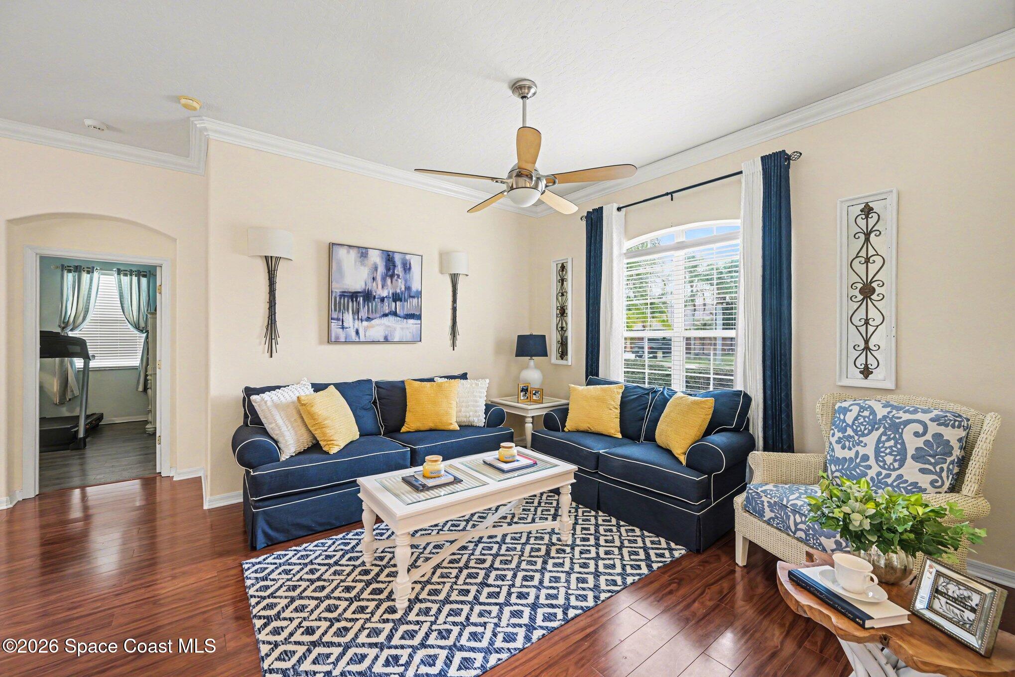 3760 Fringetree Lane Melbourne, FL 32940 - Photo 3 of 36 a living room with furniture and a rug