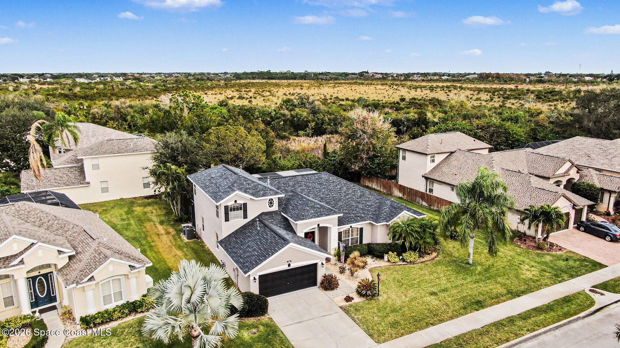 3760 Fringetree Lane Melbourne, FL 32940 - Photo 36 of 36 an aerial view of residential houses with outdoor space and ocean view