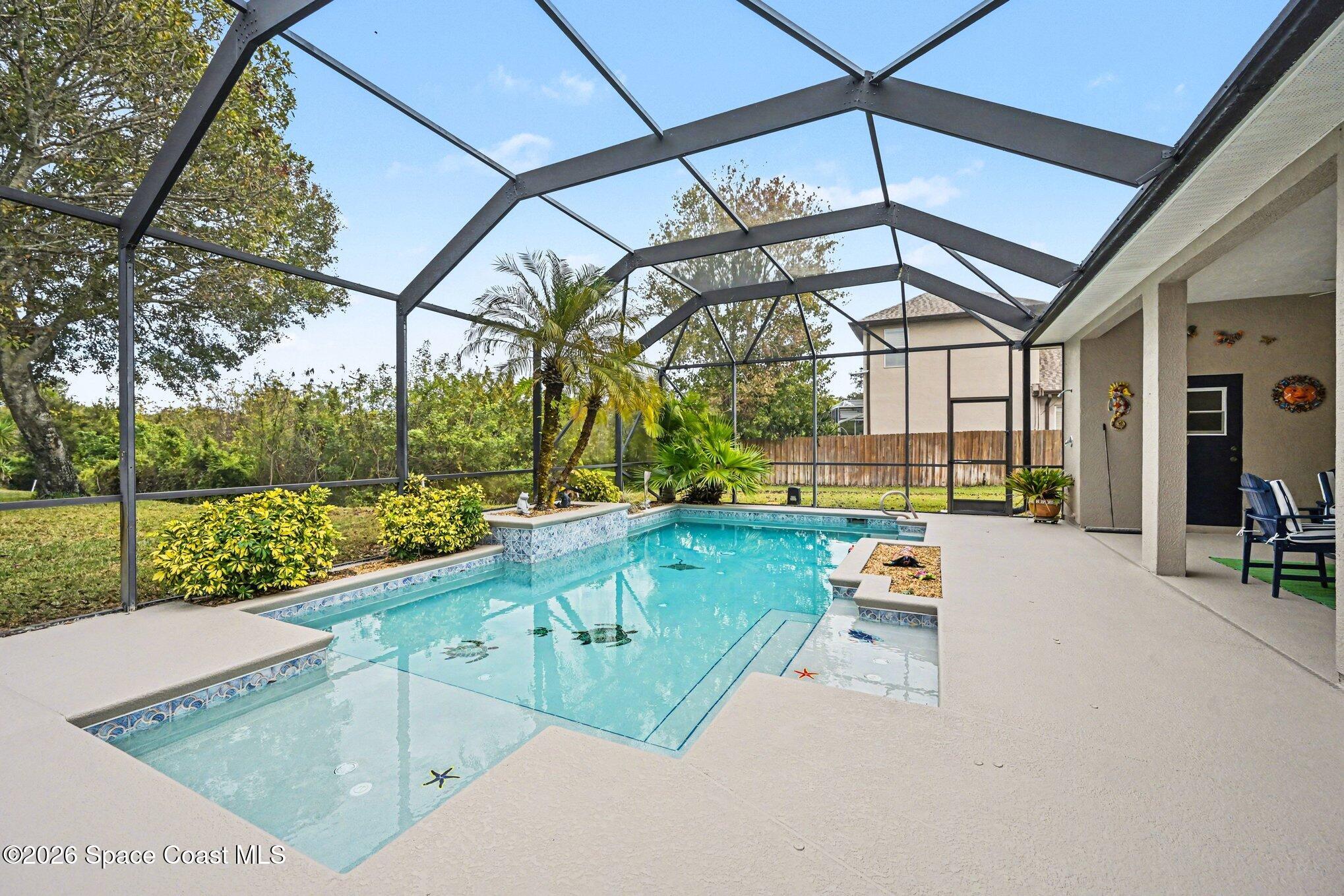 3760 Fringetree Lane Melbourne, FL 32940 - Photo 10 of 36 a view of swimming pool with a patio