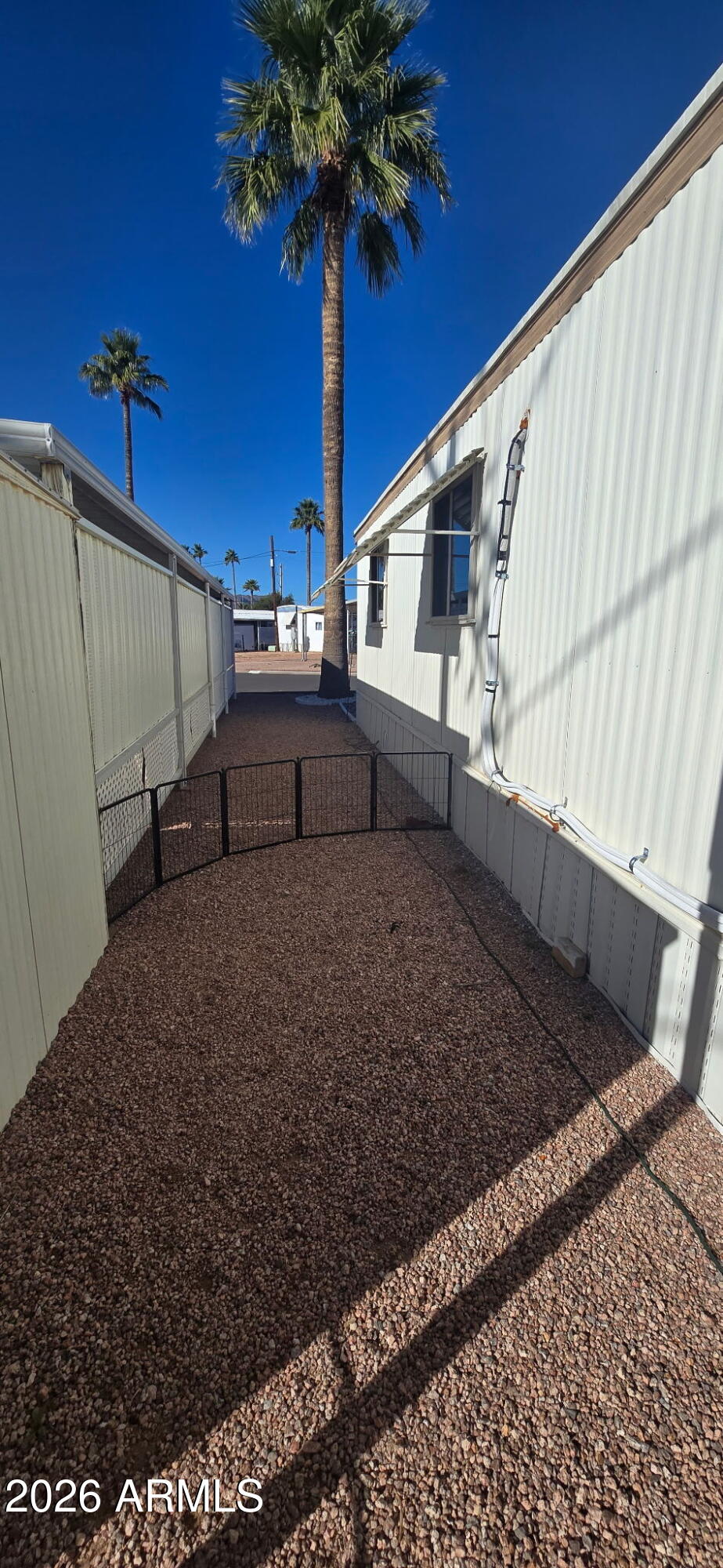800 West Apache Trail, Unit 18 Apache Junction, AZ 85120 - Photo 11 of 20 a view of a backyard with ceiling fan