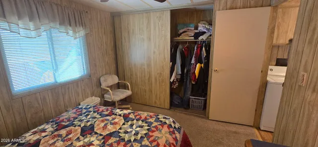 a room with a bed and a window