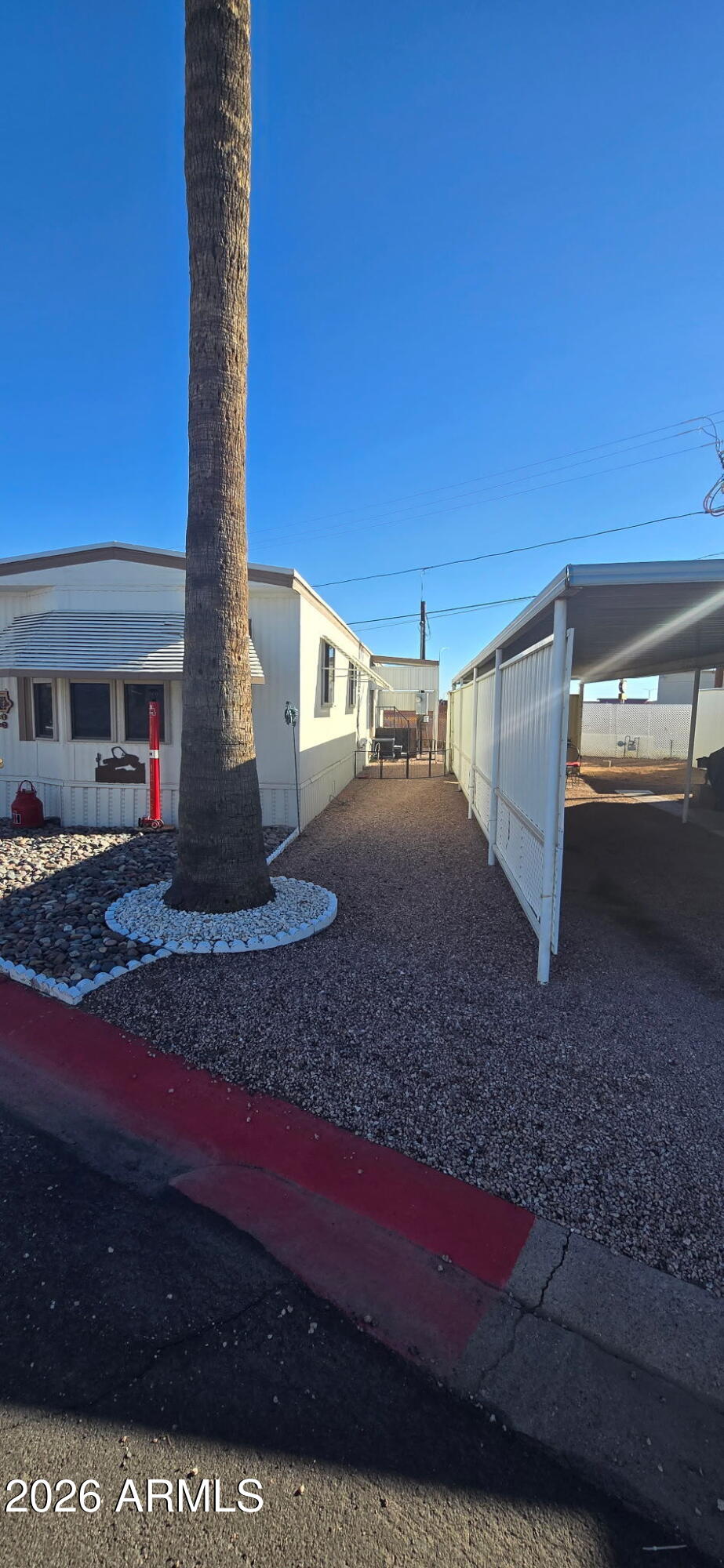 800 West Apache Trail, Unit 18 Apache Junction, AZ 85120 - Photo 2 of 20 a view of a yard with an outdoor space
