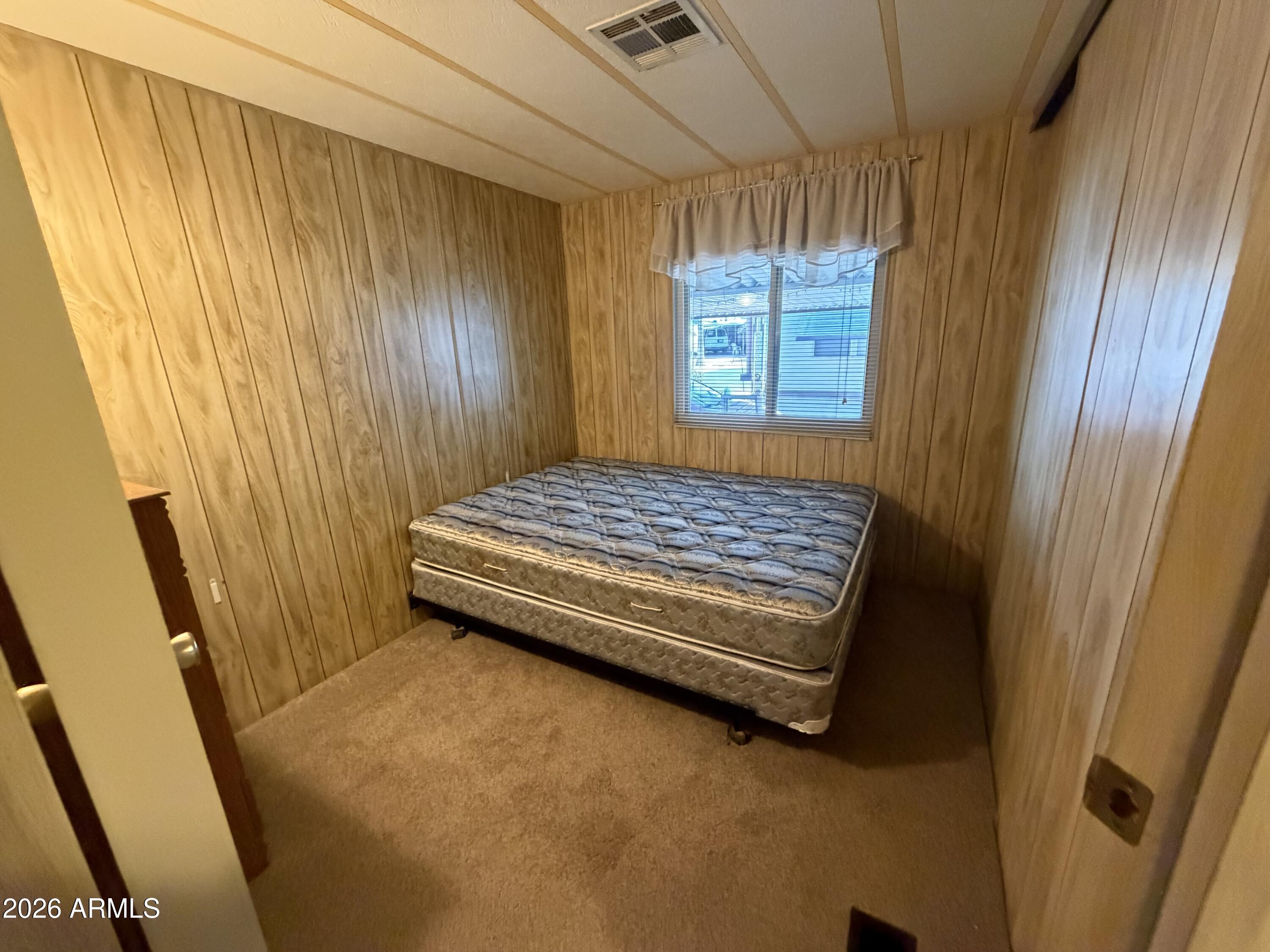 800 West Apache Trail, Unit 18 Apache Junction, AZ 85120 - Photo 24 of 24 a bedroom with a bed and a window